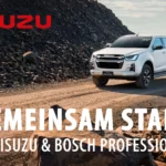 ISUZU D-MAX LSE in Weiß fährt auf staubiger Straße, Logo von ISUZU und Text "Gemeinsam stark, ISUZU & Bosch Professional" (Prämienaktion mit 23 % Nachlass für Handwerksbetriebe auf ausgewählte ISUZU D-MAX Modelle und kostenloses Profi-Werkzeugpaket von Bosch Professional)